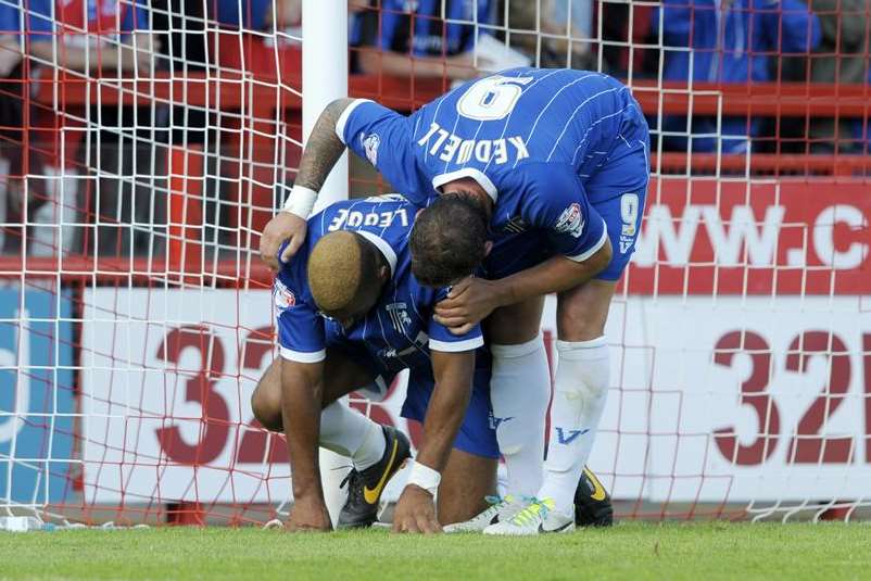 Leon Legge picks up an injury after scoring Gillingham's equaliser.