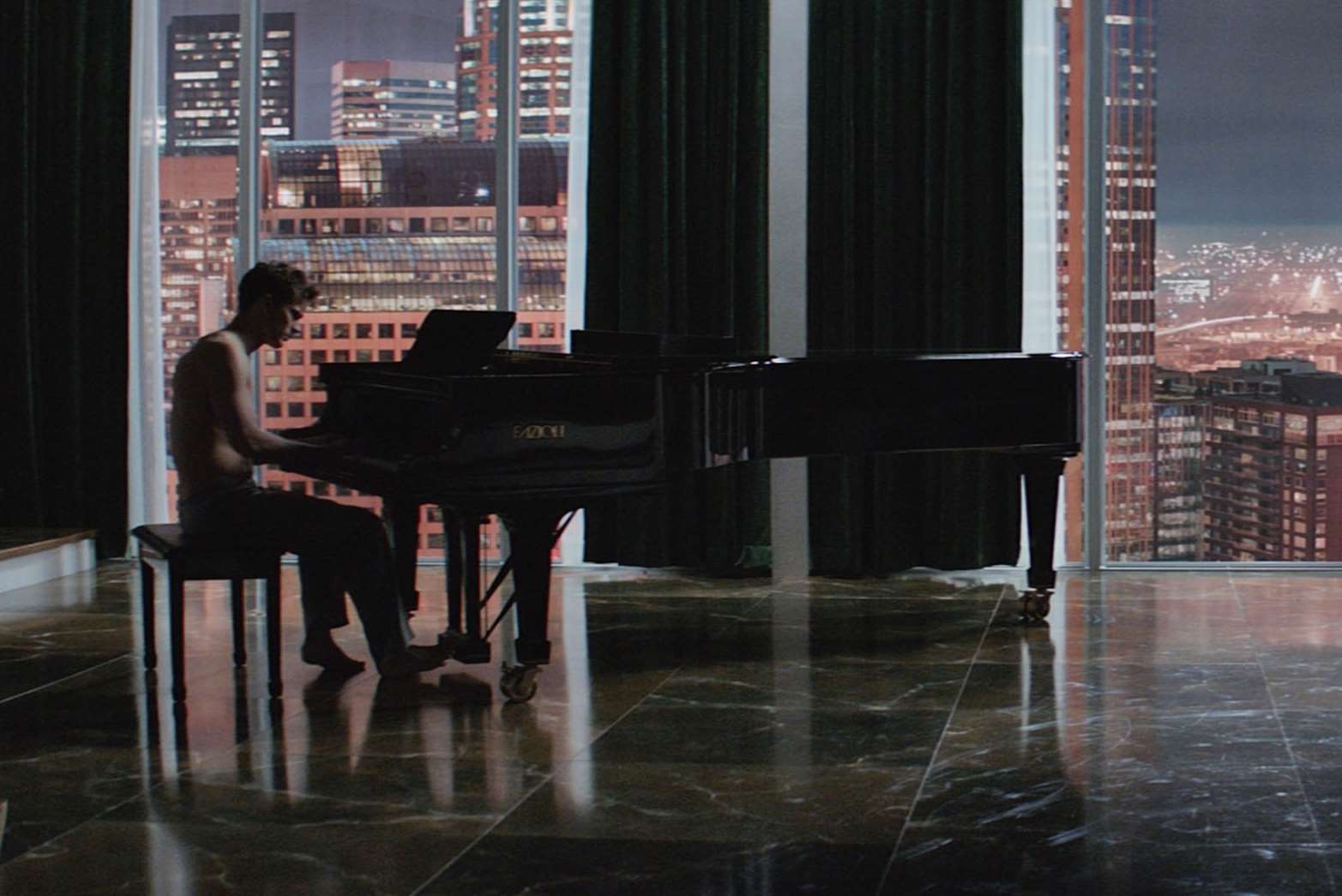 Jamie Dornan tinkling the ivories in Fifty Shades of Grey