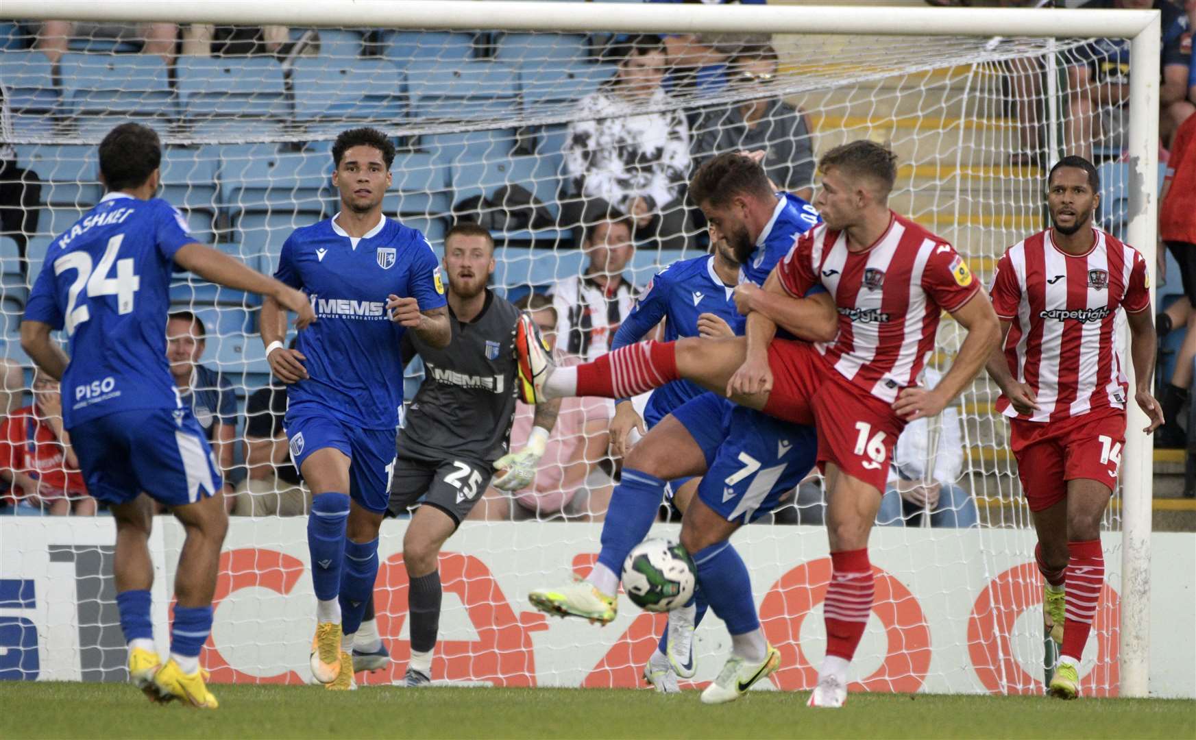 Gillingham's Alex MacDonald battles against Exeter on Tuesday night. Picture: Barry Goodwin