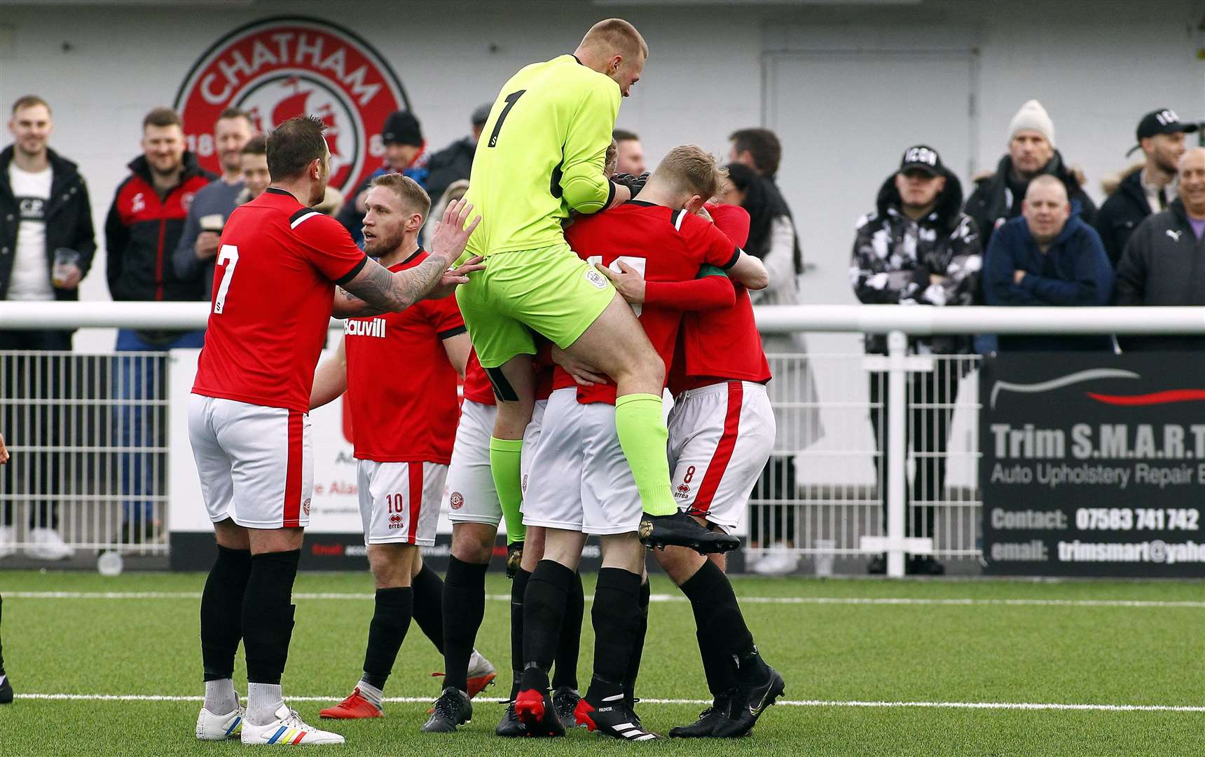 Chatham celebrate a late third scored by captain Jack Evans Picture: Sean Aidan
