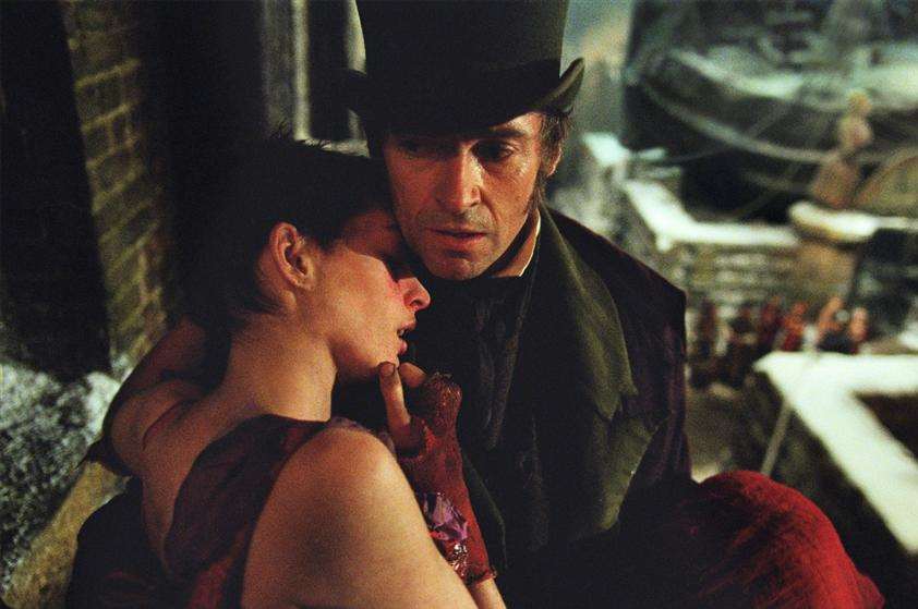 Hugh Jackman as Jean Valjean and Anne Hathaway as Fantine in Les Miserables