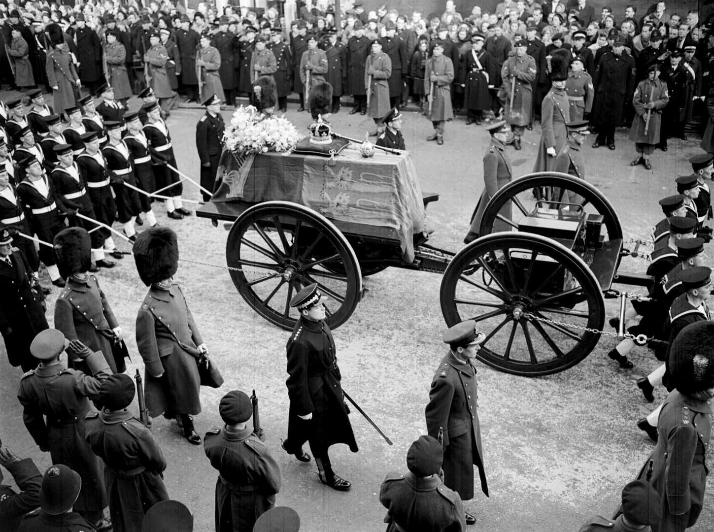 The last solemn journey of King George VI, when his coffin was pulled on ropes by sailors in procession from Windsor railway station to the funeral service in St George’s Chapel (PA)