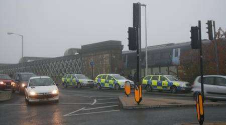 Police at Rochester railway bridge after a man threatened to jump
