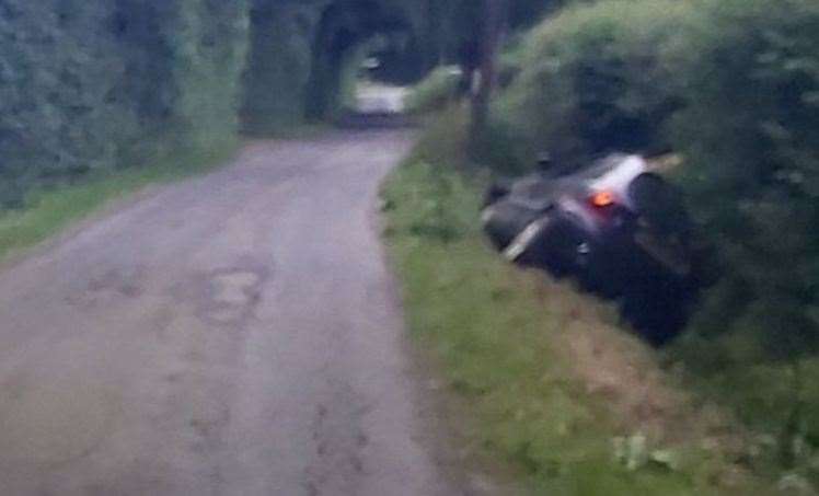 A car was found in the ditch by police in Poundhurst Road, Ruckinge, Ashford yesterday. Picture: Kent Police