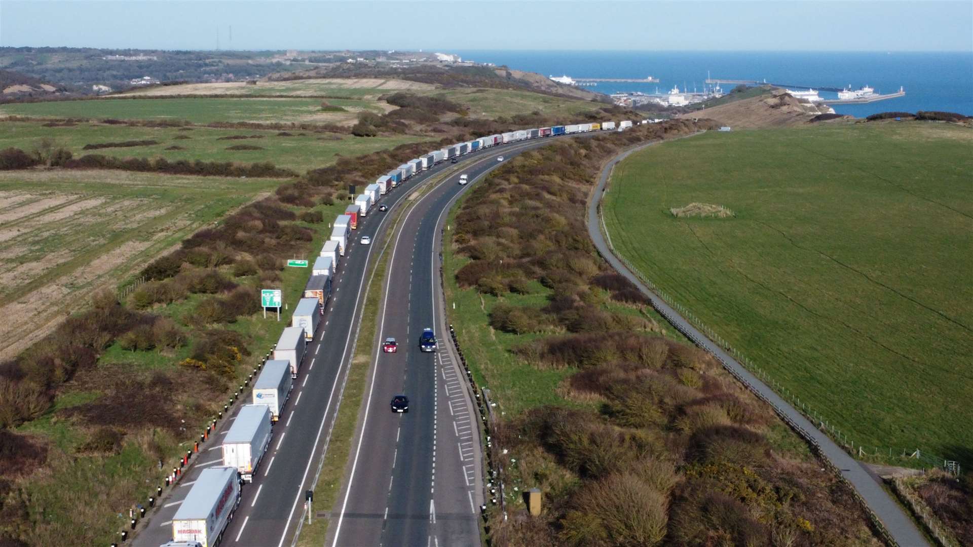 Long line of lorries wait on the A20 heading into Dover, as part of TAP, after P&O Ferries announced the suspension of their services. Picture: Barry Goodwin