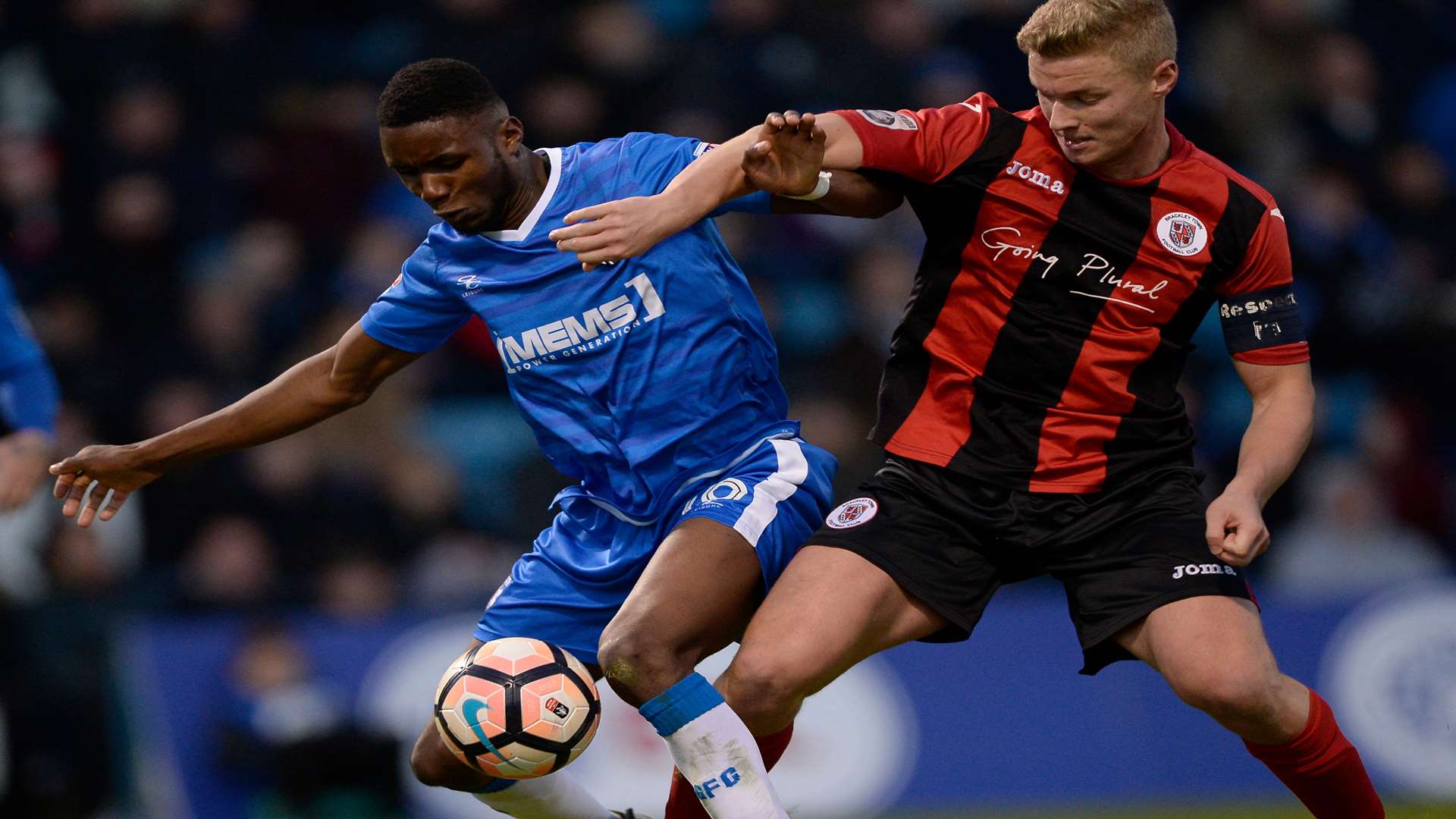 Emmanuel Osadebe battles it out with Gareth Dean Picture: Ady Kerry