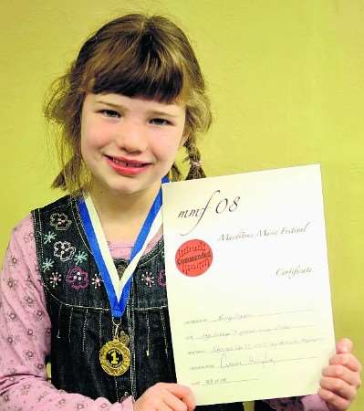 Lucy Ogden, seven with her piano solo first prize