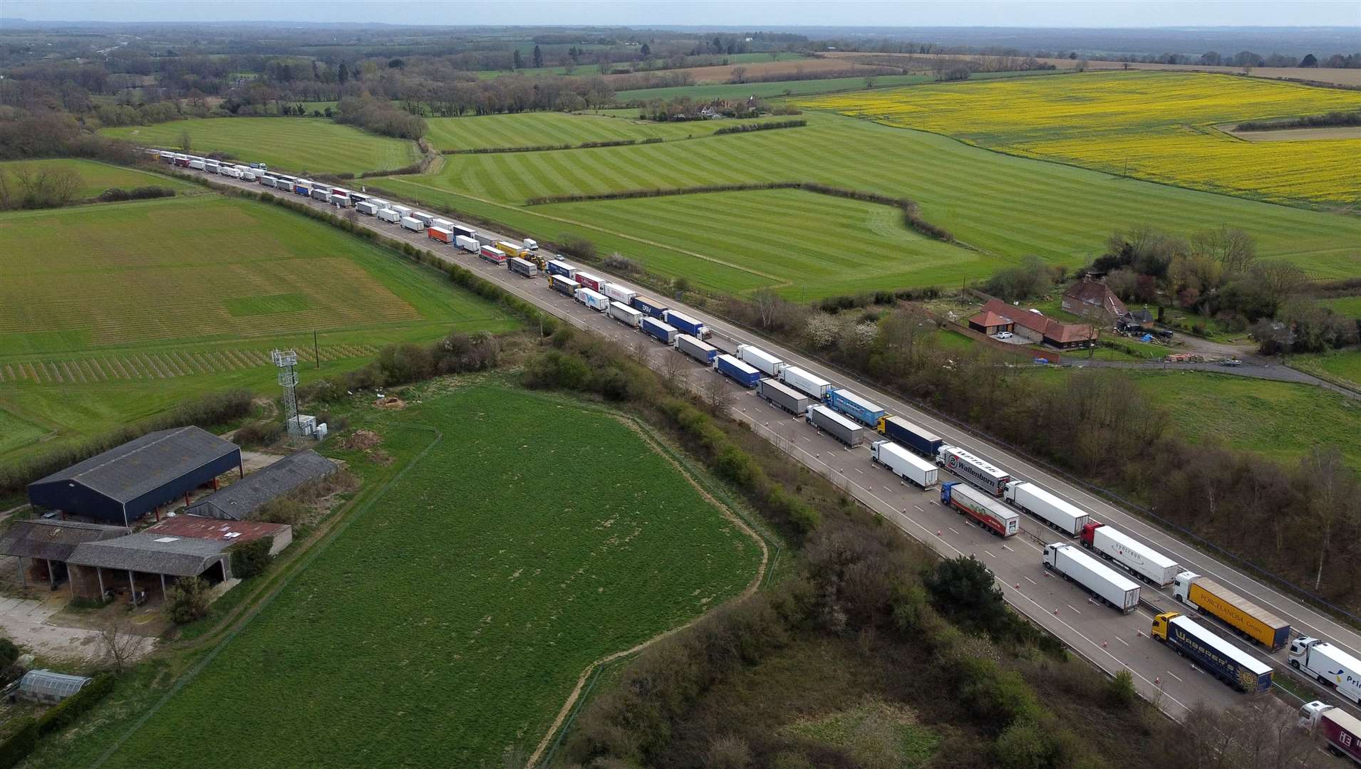 Lorries queue up on the M20 near Ashford in Kent as freight delays continue at the Port of Dover where P&O ferry services remain suspended after the company sacked 800 workers without notice (Gareth Fuller/PA)