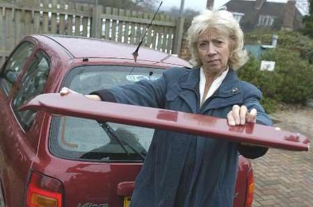 Doreen Hartley with the car's damaged spoiler. Picture: GRANT FALVEY