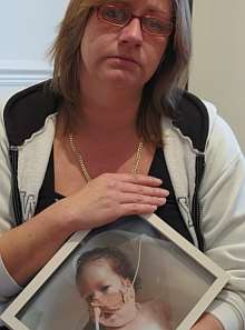 Rachil Jones with a picture of her daughter Sian Myfanwy, who died in July.