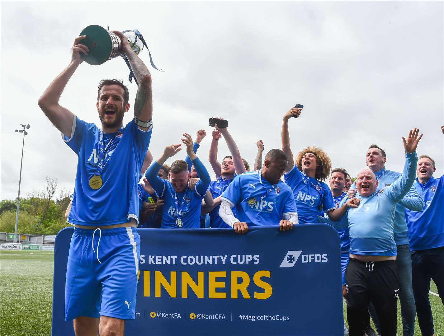 Market Hotel captain Ryan Smith lifts the trophy. Picture: Ian Scammell