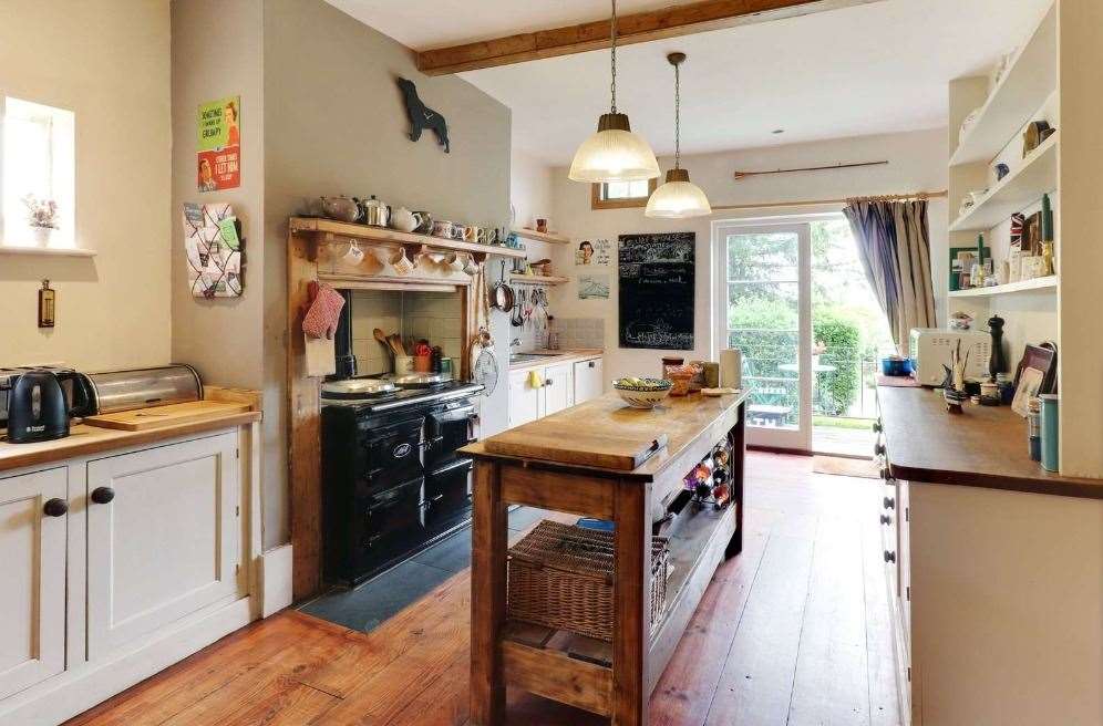 The kitchen and breakfast room has wonderful views out into the colourful garden. Picture: Savills