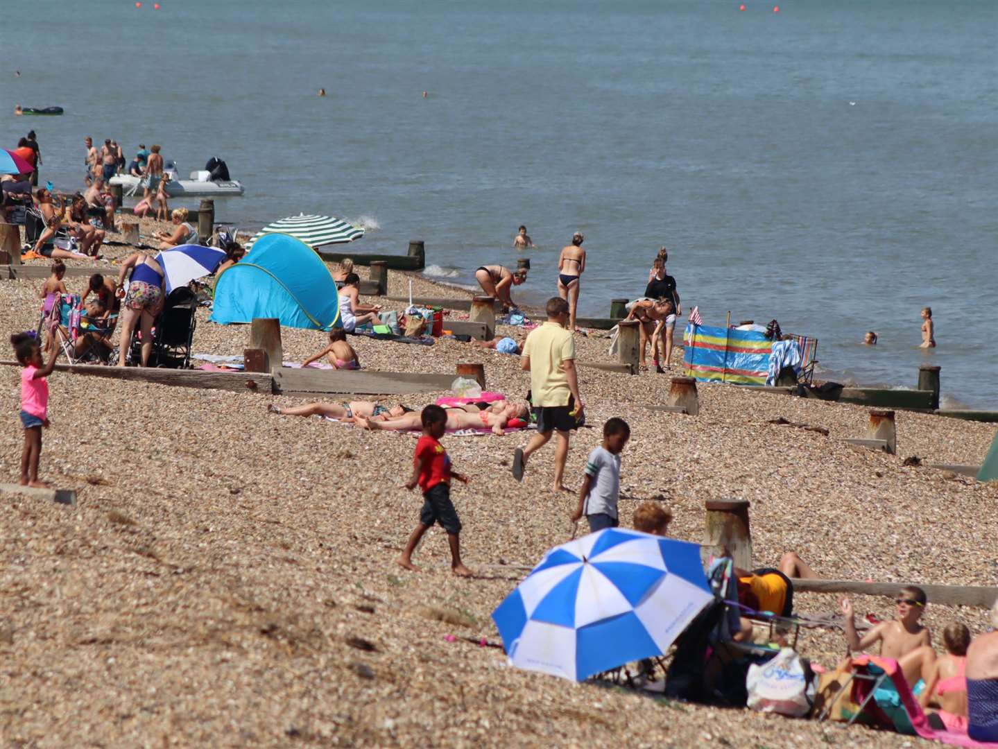 Bathers at the Leas at Minster on the Isle of Sheppey on one of the hottest days of 2020