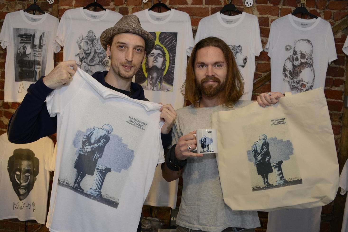 Stephen Bail and Colin White of The Quarter Masters shop in the Old High Street and their Banksy products