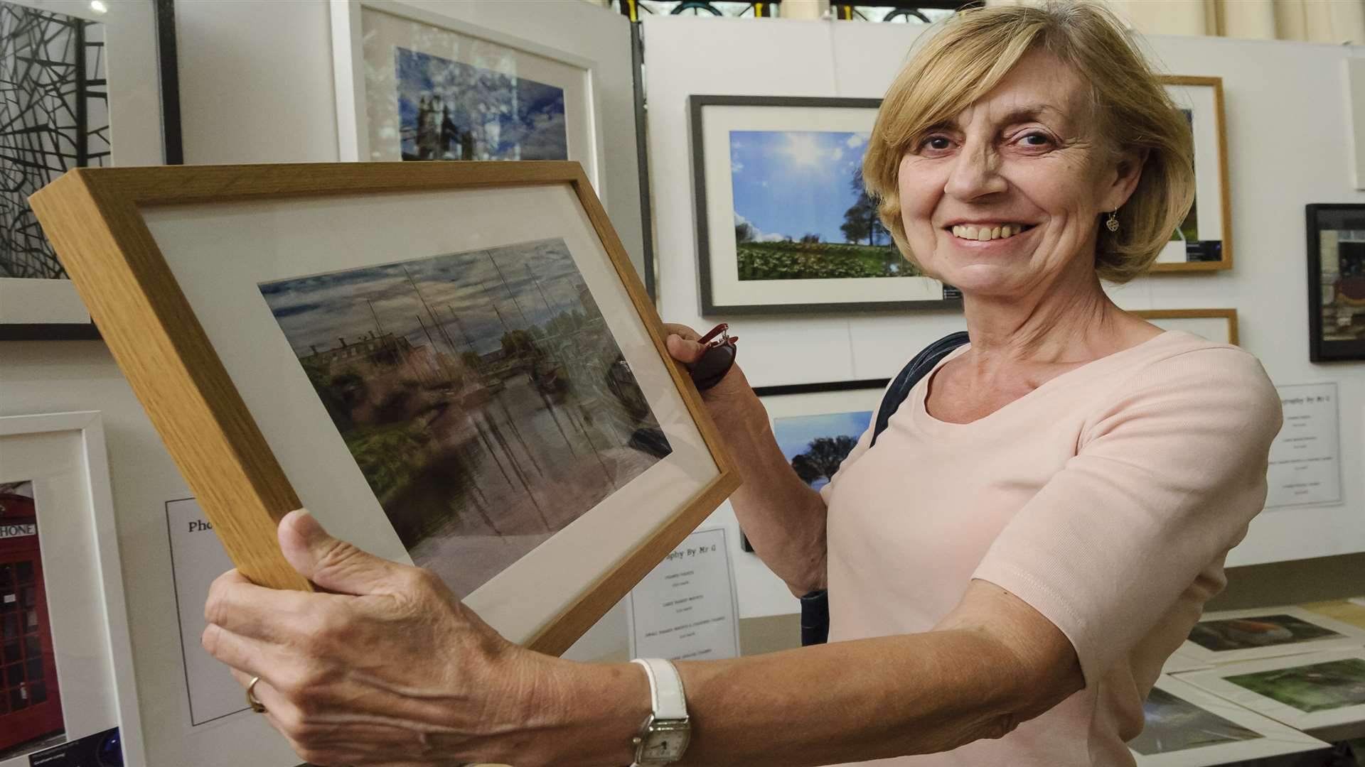 Marlene Murphy looks at Mr G's images at the Showcase Kent photography exhibition