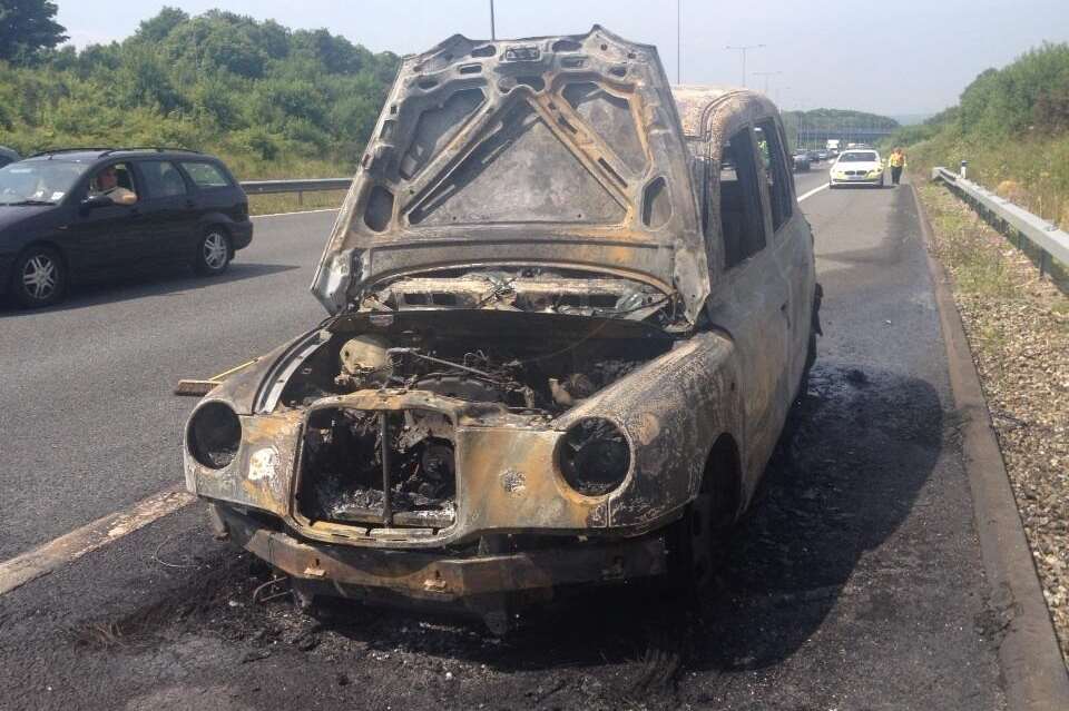 The burnt out London taxi on the M2. Picture: @kentpoliceroads