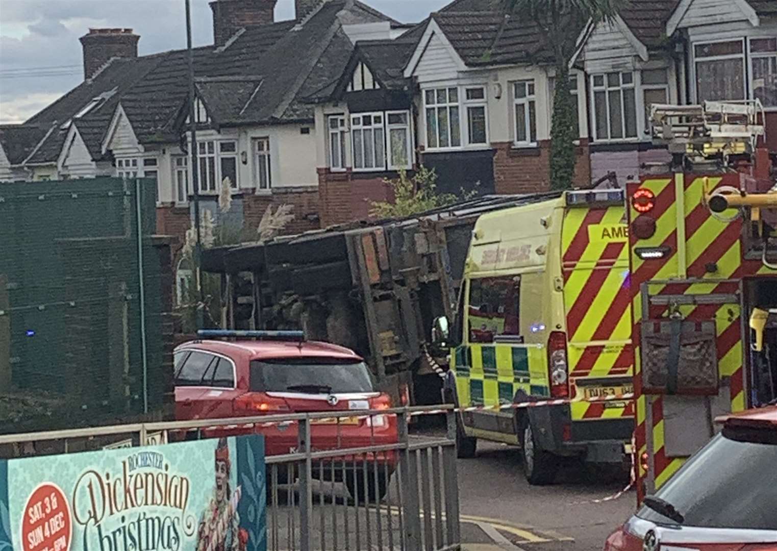 A lorry is on its side in Station Road
