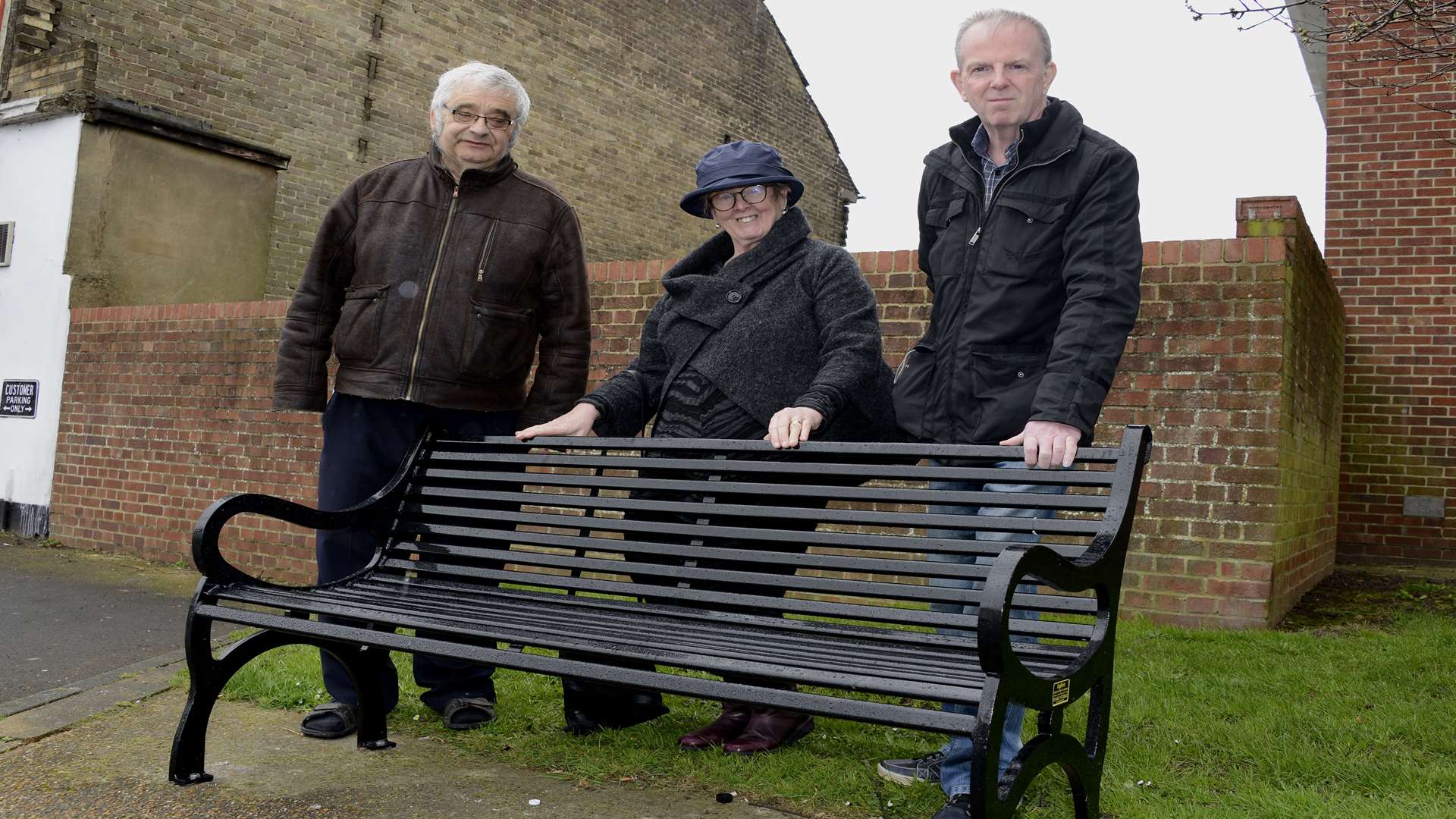 Cllrs Ben Bano Eileen Rowbotham and Sid Pollitt behind the newly-installed bench opposite the Co-Op store off Mill Hill, Deal.