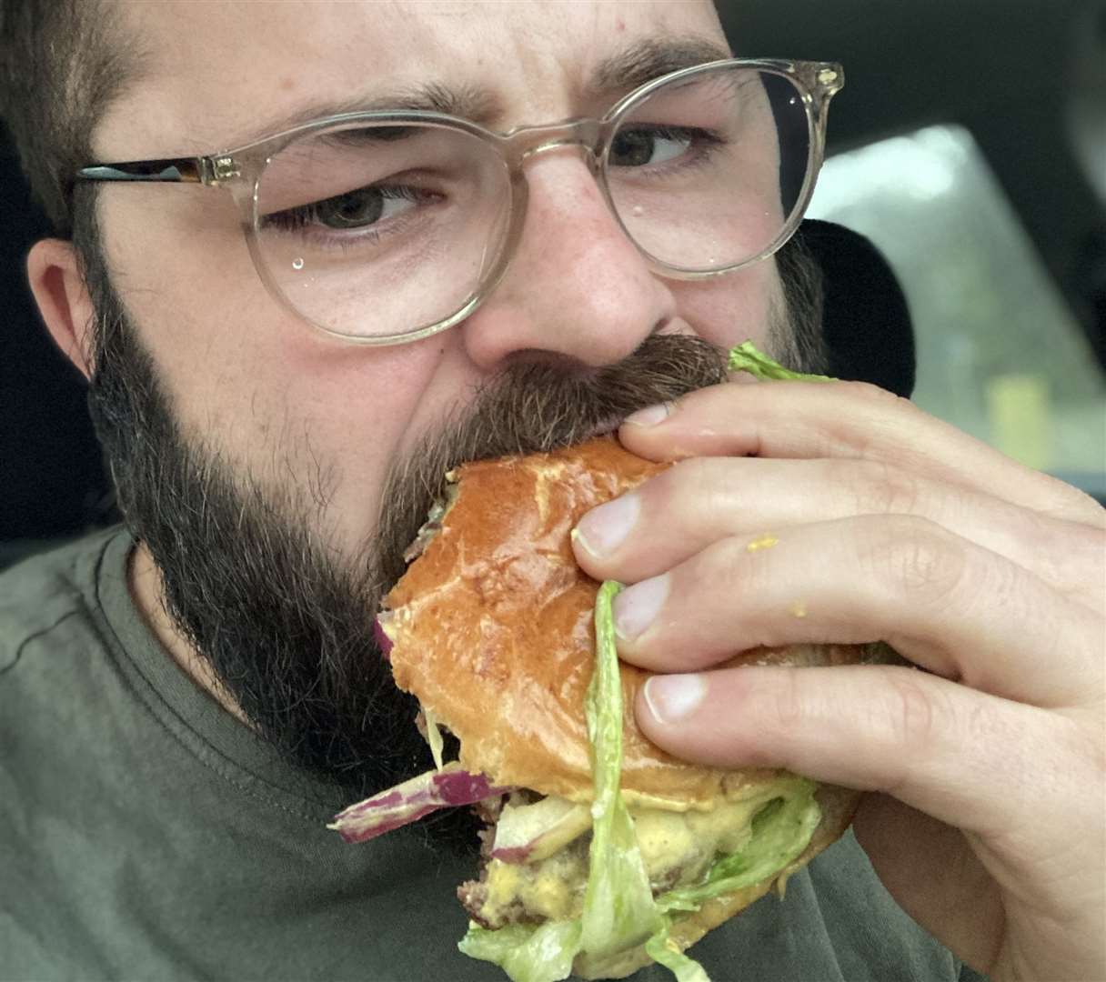 A man furious at traffic tucks in to his burger