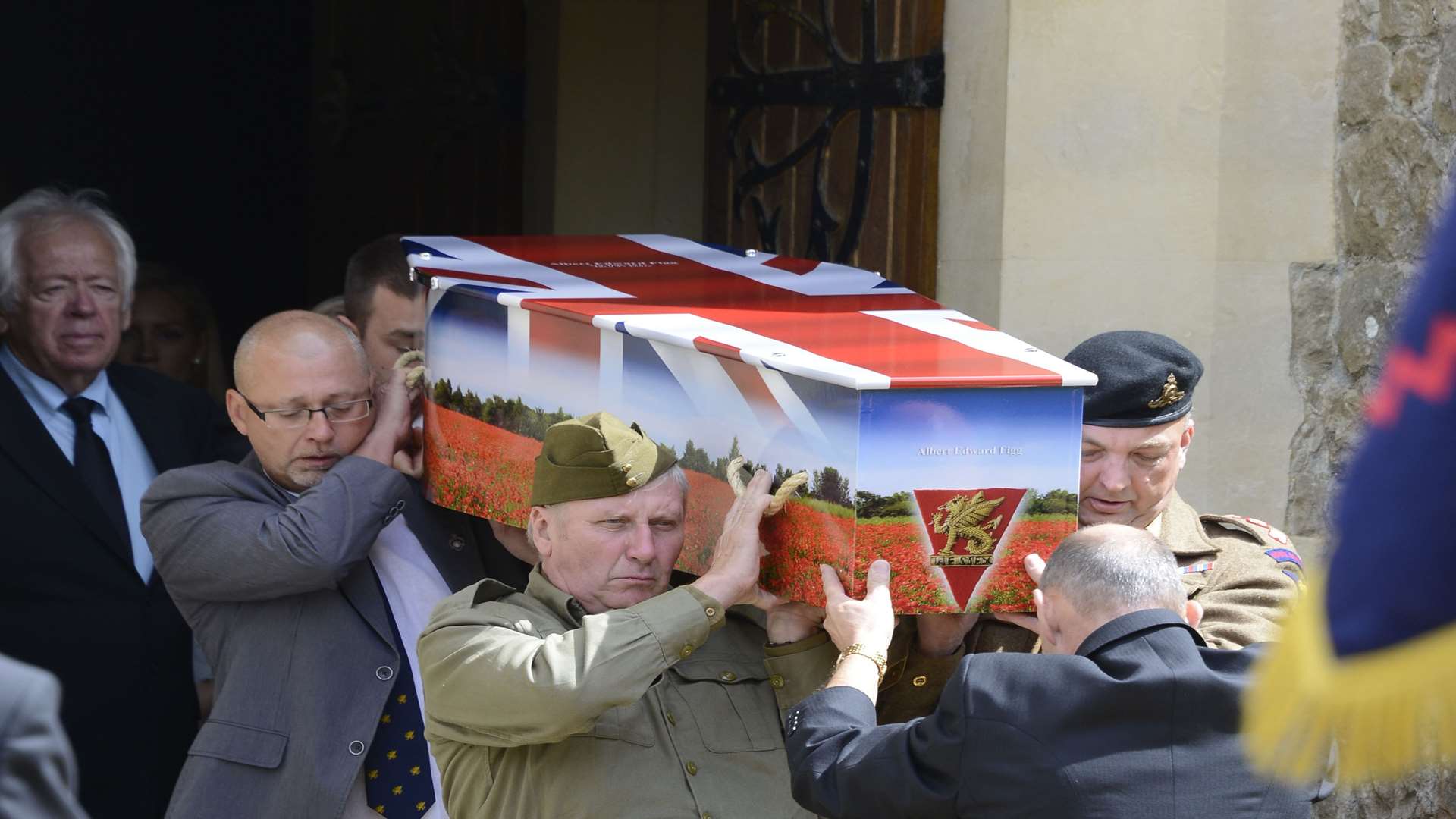 Albert Figg's coffin is carried from the chapel