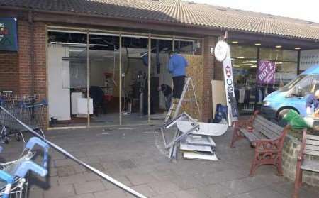 Workmen repairing the damage after the raid. Picture: BARRY CRAYFORD