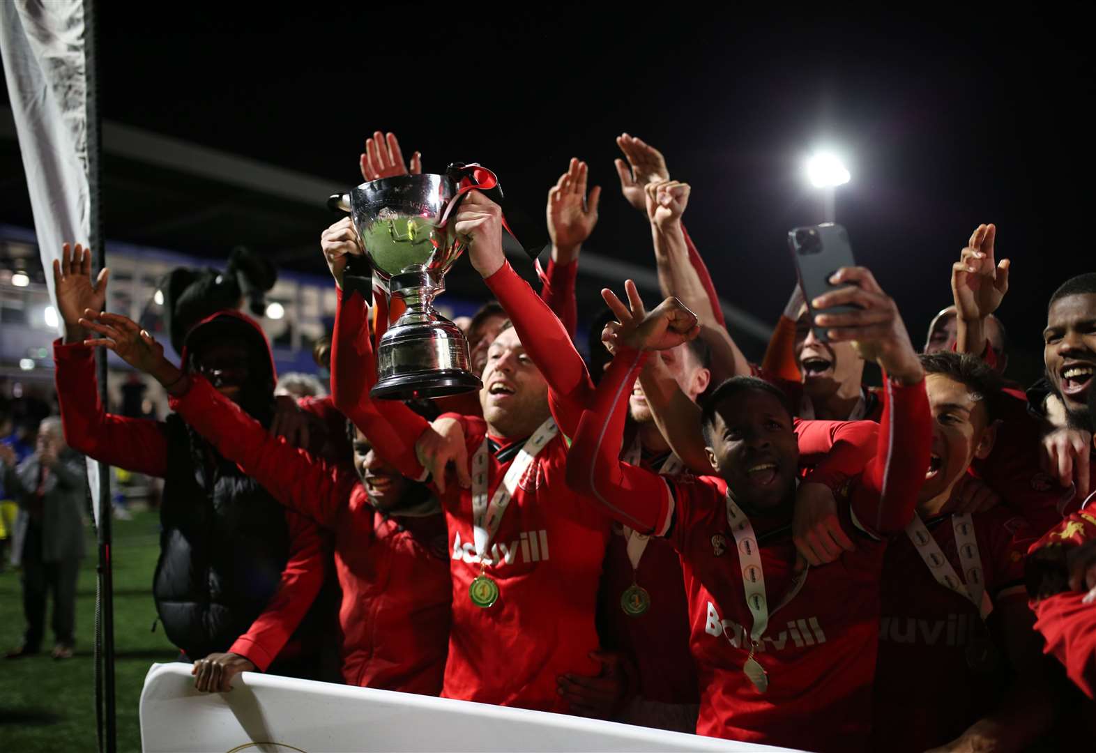 Chatham captain Jack Evans lifts the Velocity Cup after beating Hashtag United Picture: Max English
