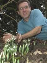 Steve Songhurst with snowdrops in flower at Vinters Valley Nature Reserve in Maidstone. Picture: JOHN WARDLEY