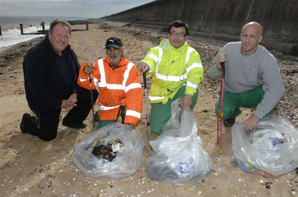 Instruction Officer Ian Duey with community workers from HMP Standford Hill who have been busy clearing the beach of litter at Leysdown