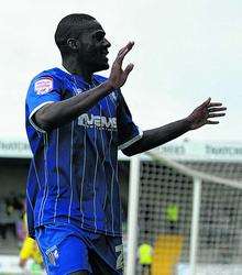 Frank Nouble celebrates his goal with the Gillingham fans.