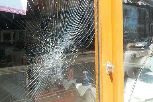 A window was smashed during the incident at Roma Pizza