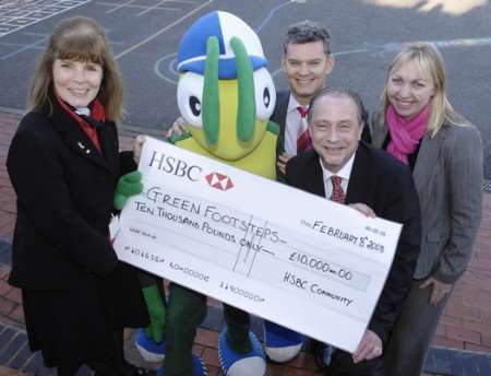 Picture: Julia Smith and Stuart Wharf from HSBC Maidstone join Peter Bull Head of Community for HSBC (UK) and Samantha Thorne Regional Manager HSBC to present a sponsorship cheque to Buster the Walking Bug.