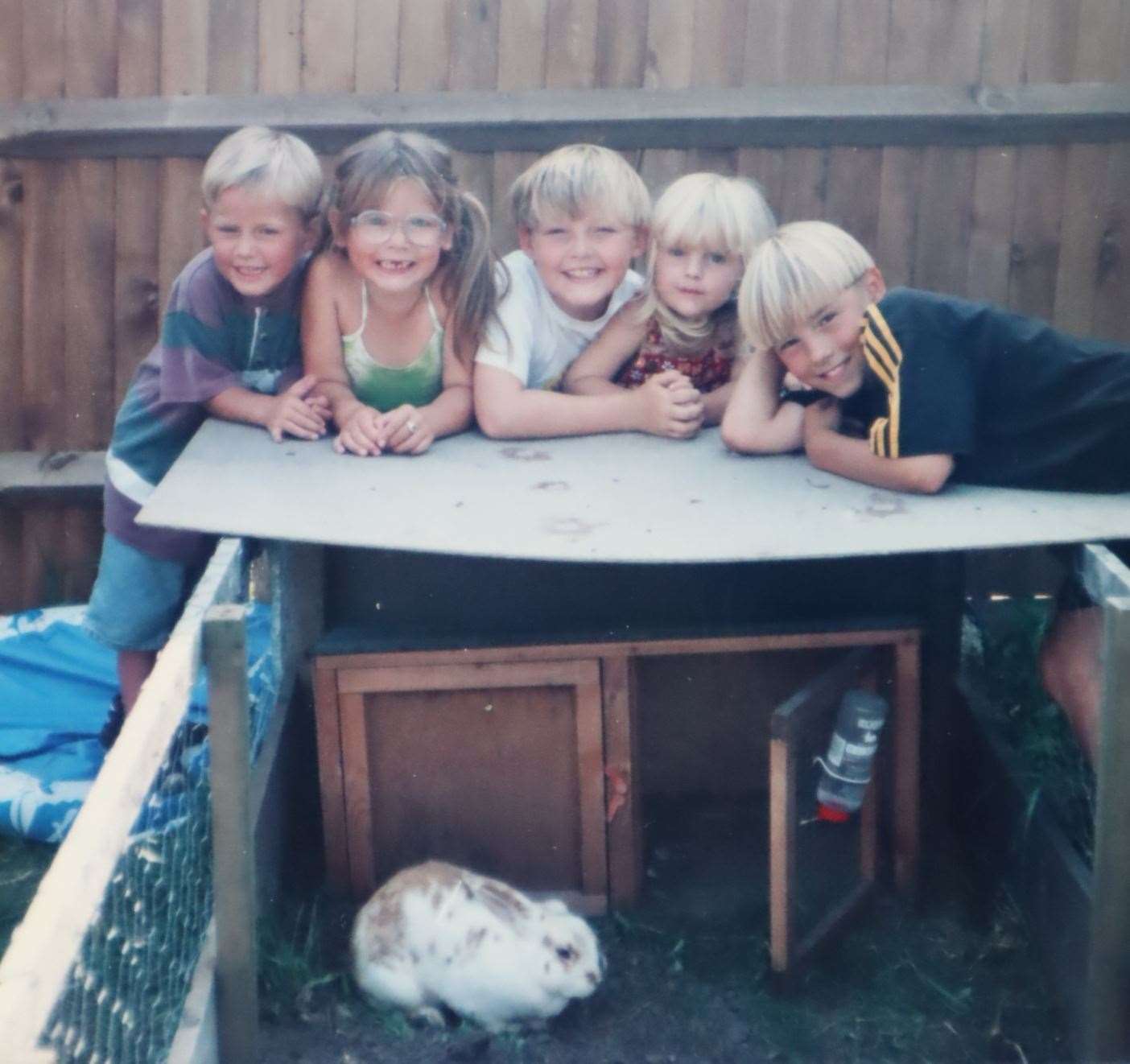 Luke Sullivan, centre, at his Aunty Diane's house with, from the left, his brother Chriony and cousins Amber, Alice and Ross with Thumper the rabbit