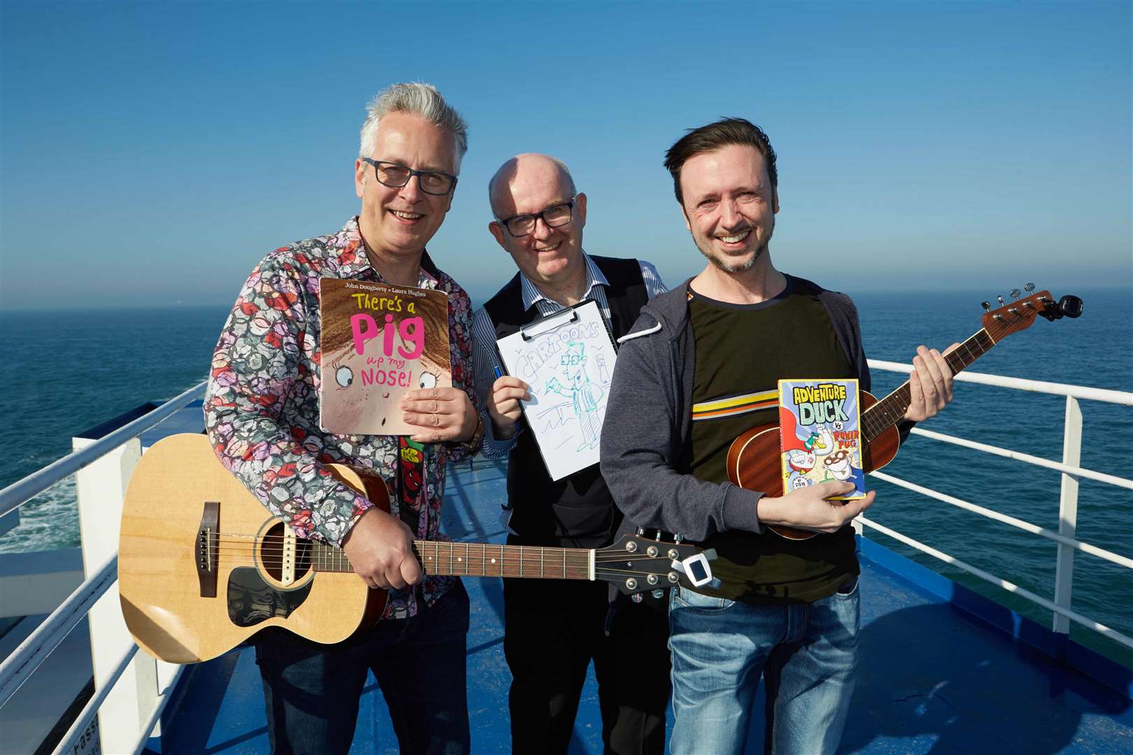 Authors John Dougherty and Steve Cole with cartoonist John Byrne (centre) held World Book Day workshops on a DFDS ferry