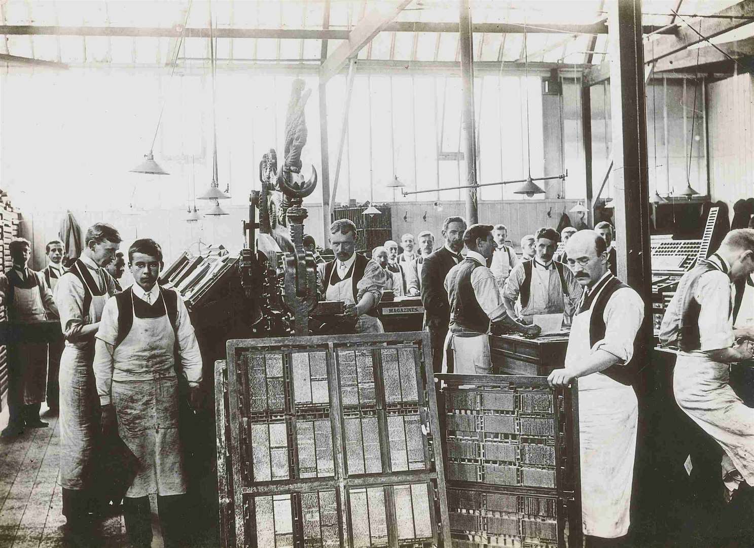 Compositors at work in the Headley Brothers print shop in old times