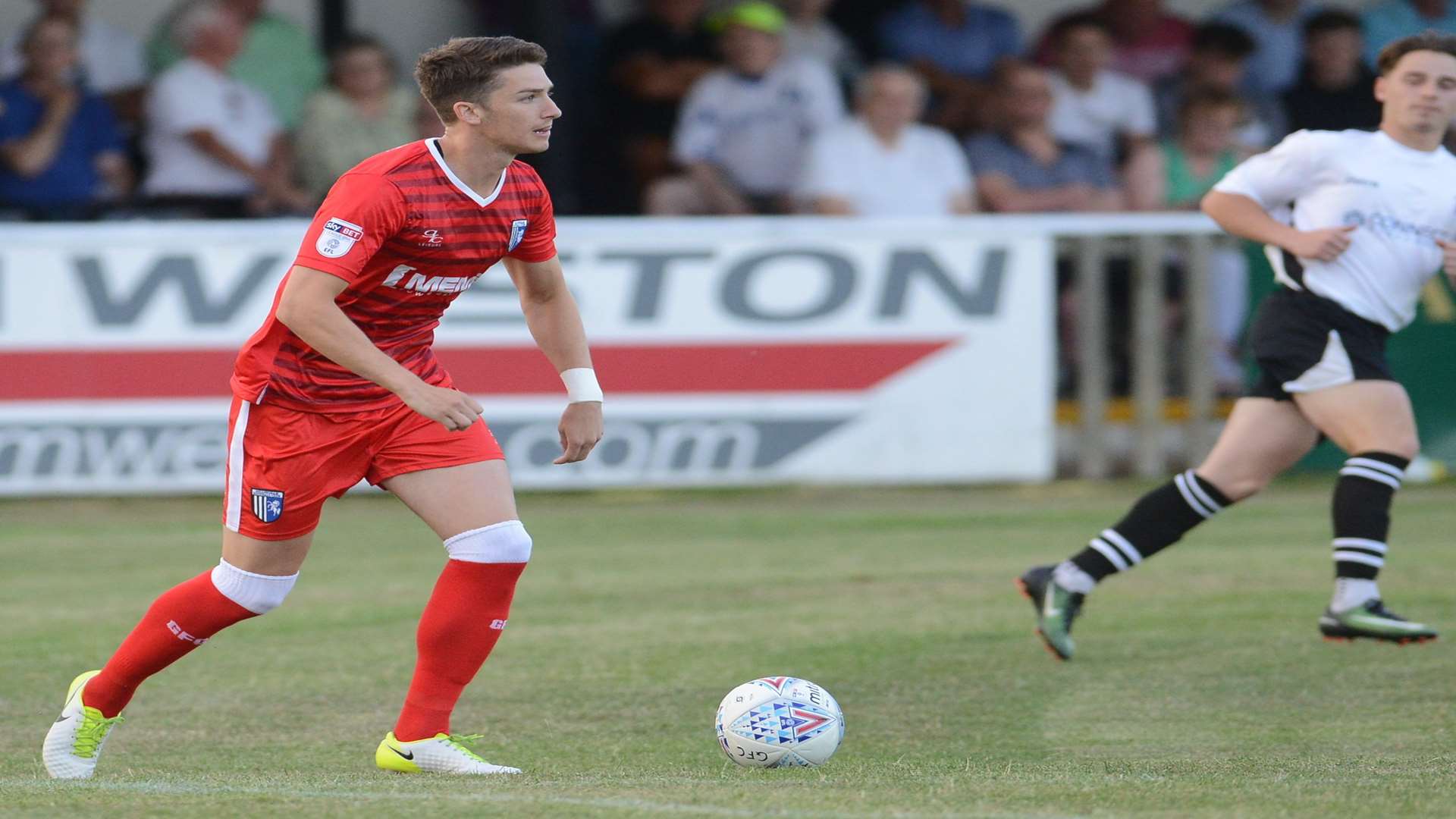 Alex Lacey in pre-season action against Faversham. Picture: Gary Browne