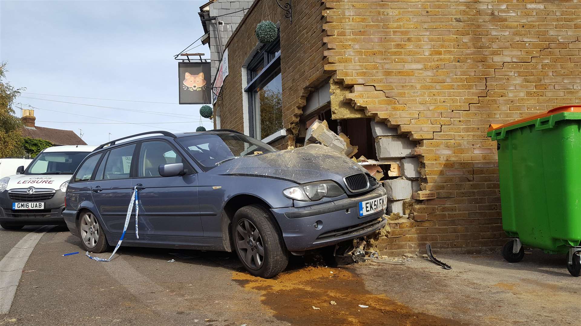 The blue BMW smashed into the corner of the pub's extension
