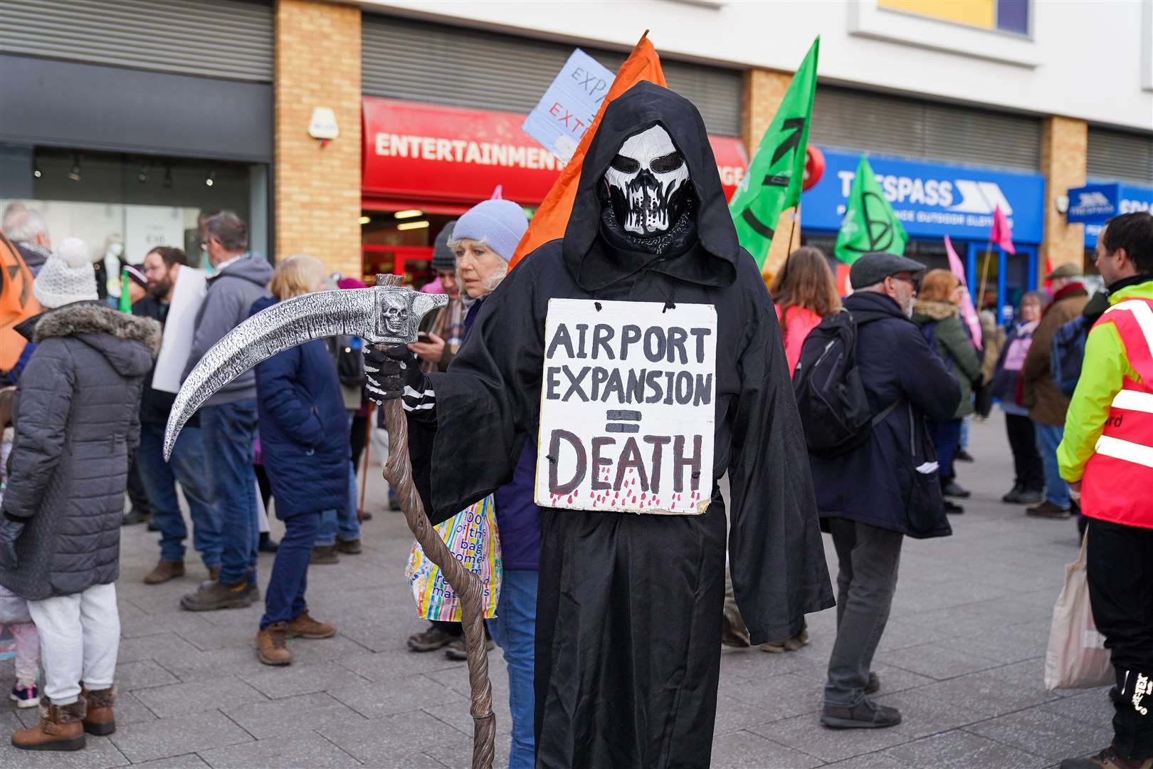 Extinction Rebellion activists and climate change campaigners demonstrate outside Farnborough Airport to protest against plans to increase private jet flights (Extinction Rebellion/PA)