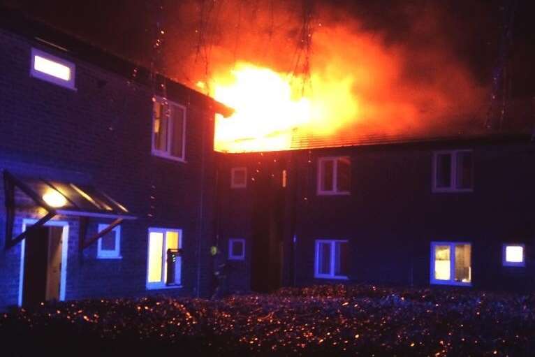 Fire engulfs a section of a campus building. Picture: @Kent_999s
