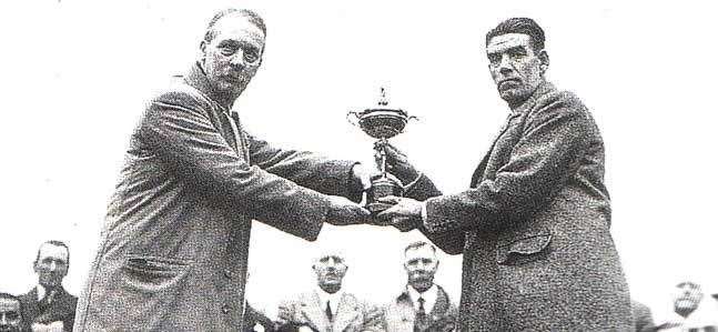 George Duncan (right) receives the winner's trophy