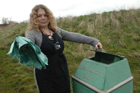 Vicki Carden with plastic bags and one of the dog waste bins at the Barton's Point Coastal Park, Sheerness