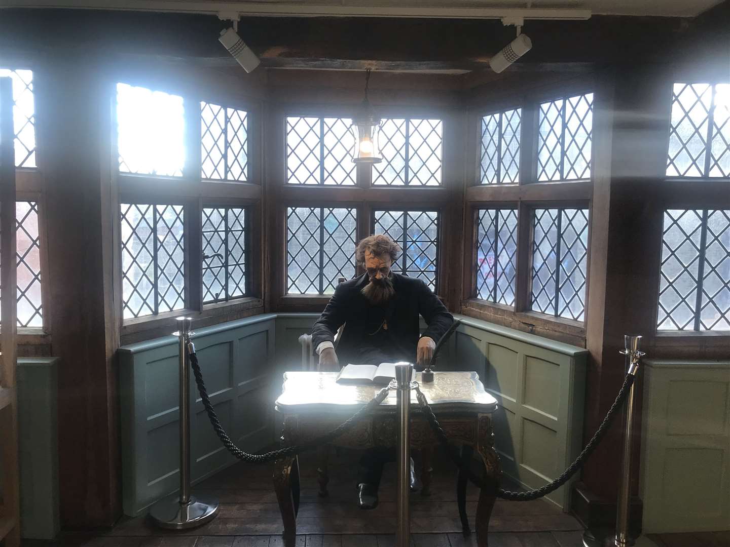 Dickens at his desk in the Dickens Room at Eastgate House