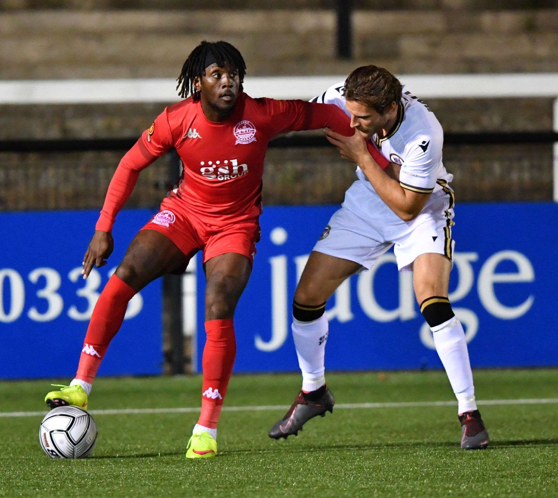 Ade Azeez (red) in action for Dover at Bromley last season Picture: Keith Gillard