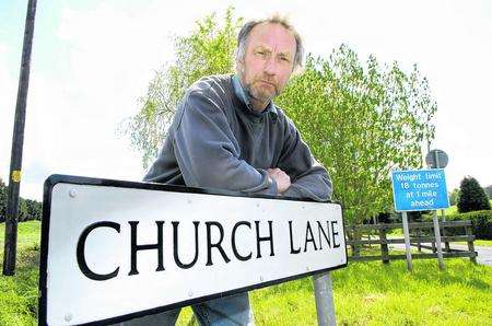 Geoff Cornes with the Church Lane/ Road sign in Kenardington
