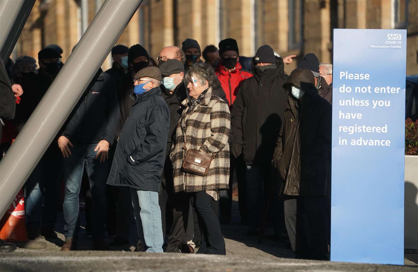 Members of the public arrive to receive their injection of a Covid-19 vaccine at the NHS vaccine centre in Newcastle (Owen Humphreys/PA)