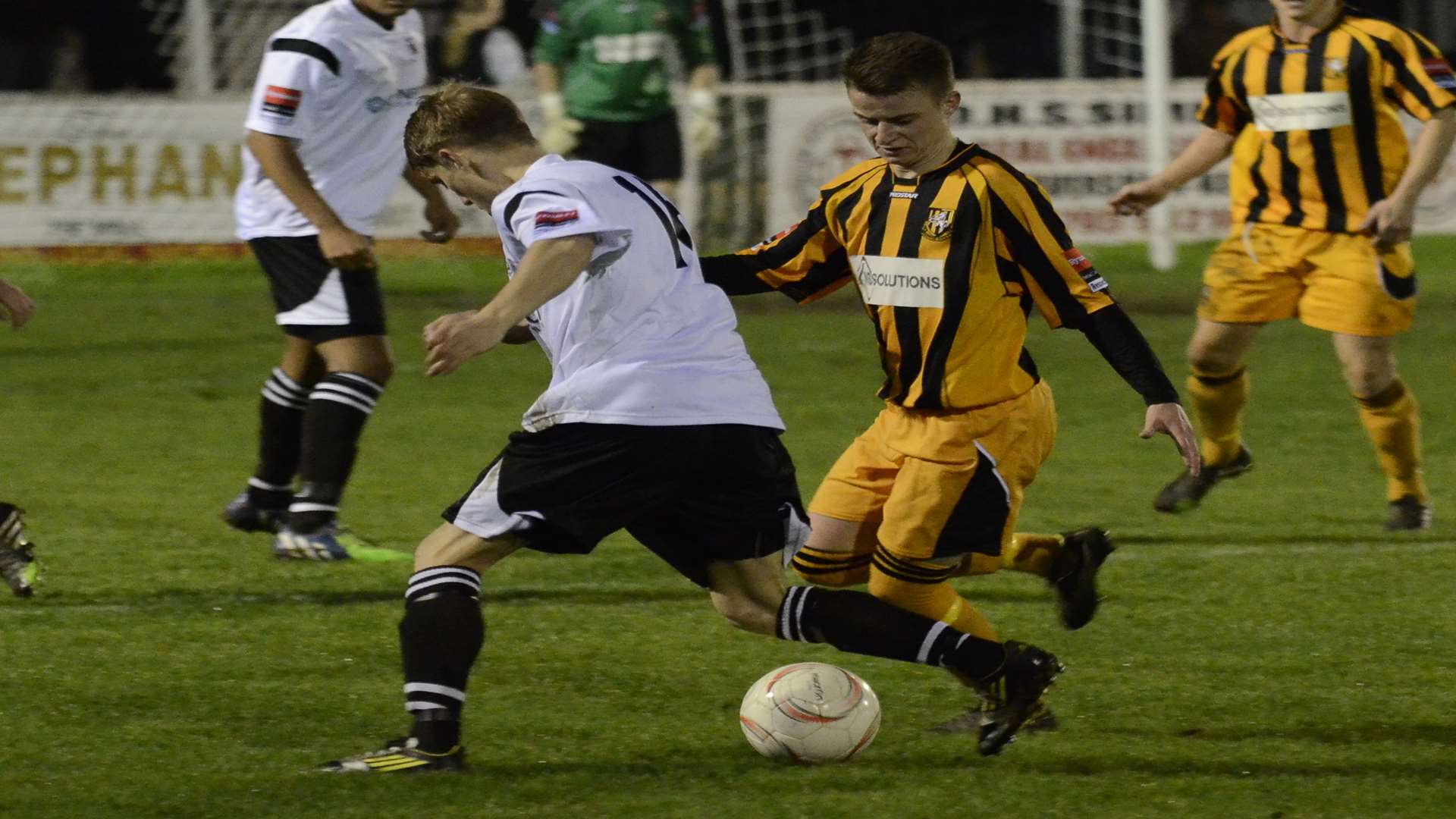 Jordan Wright battles for possession during Folkestone's 2-2 draw at Faversham Picture: Chris Davey