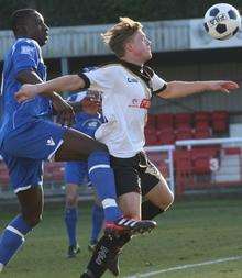 Welling's Anthony Acheampong challenges Dover's George Purcell