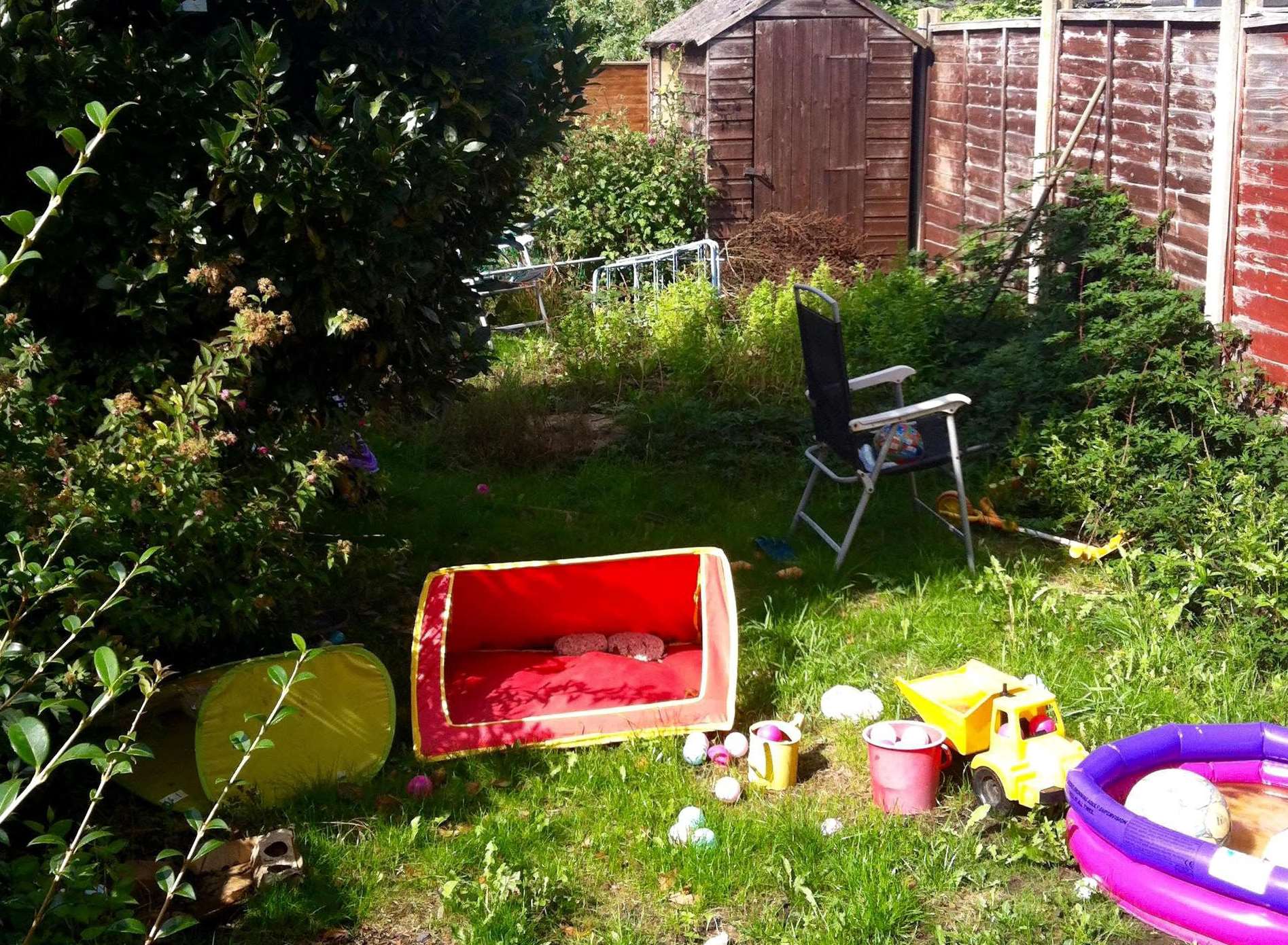 The garden was overgrown and strewn with rubbish