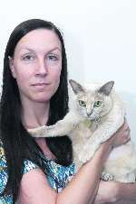 Ellan Iaquaniello with her injured cat Meg