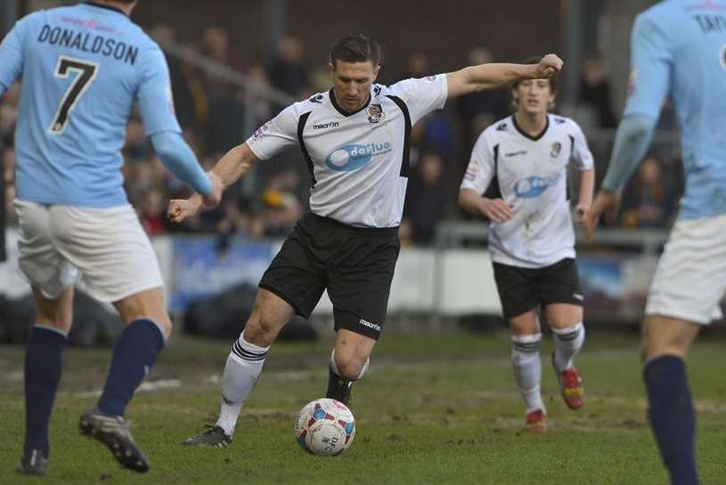 Lee Burns plays the ball forward against Cambridge (Pic: Andy Payton)