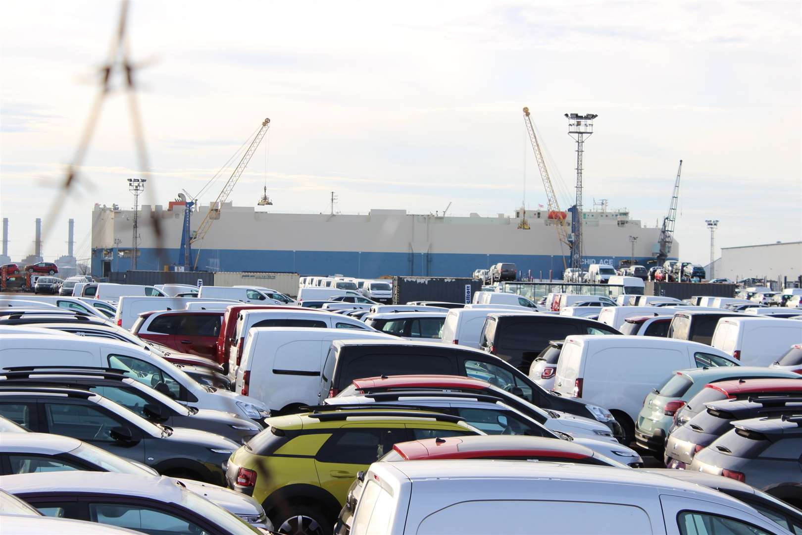 Imported cars on the docks near where the cement works will be built